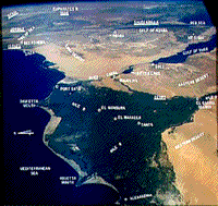 Color photograph showing Egypt's Nile Delta in the foreground, with the Gulf of Aqaba-Dead Sea in the background, taken during the Gemini 4 mission.></a> </CENTER> <P> This picture highlights two characteristics of many of the astronaut photos: 1) they are oblique shots that often contain the Earth's horizon in the background (but sometimes the curvature is from the window of the spacecraft), and 2) there is often a blue cast that overprints the entire photo, which results from blue backscattering from the atmosphere. <p><b><a name=