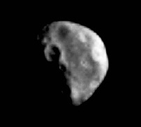 B/W Galileo image of Dactyl, a small body unexpectedly found orbiting the asteroid Ida.